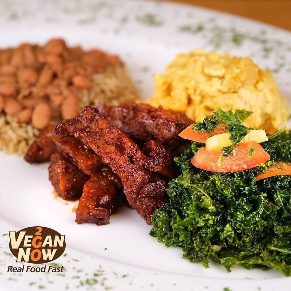 Vegan Now 2 Go meal with plant-based meat, rice and beans, mashed potatoes, and kale salad.